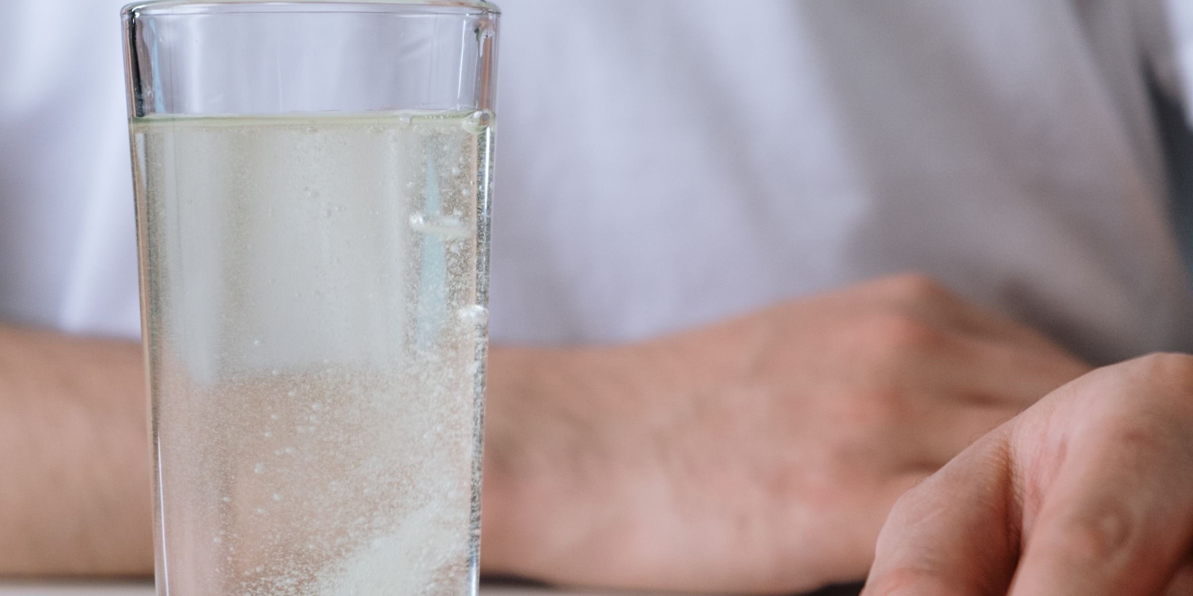 Effervescent tablet dissolving in a glass of water