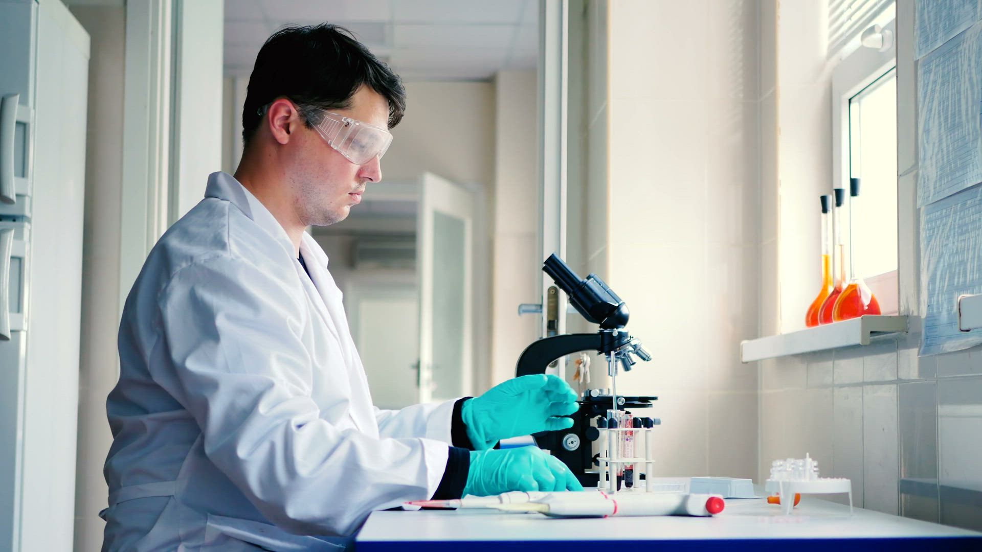 Analyst preparing a sample in a laboratory